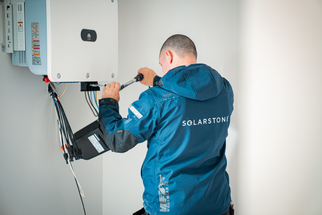 Solarstone electrician installing Huawei inverter