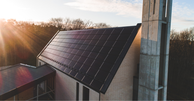 saku church with solar roof and sunset