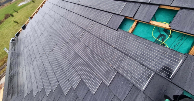 an image of solarstone solar tiled roof with roof tiles
