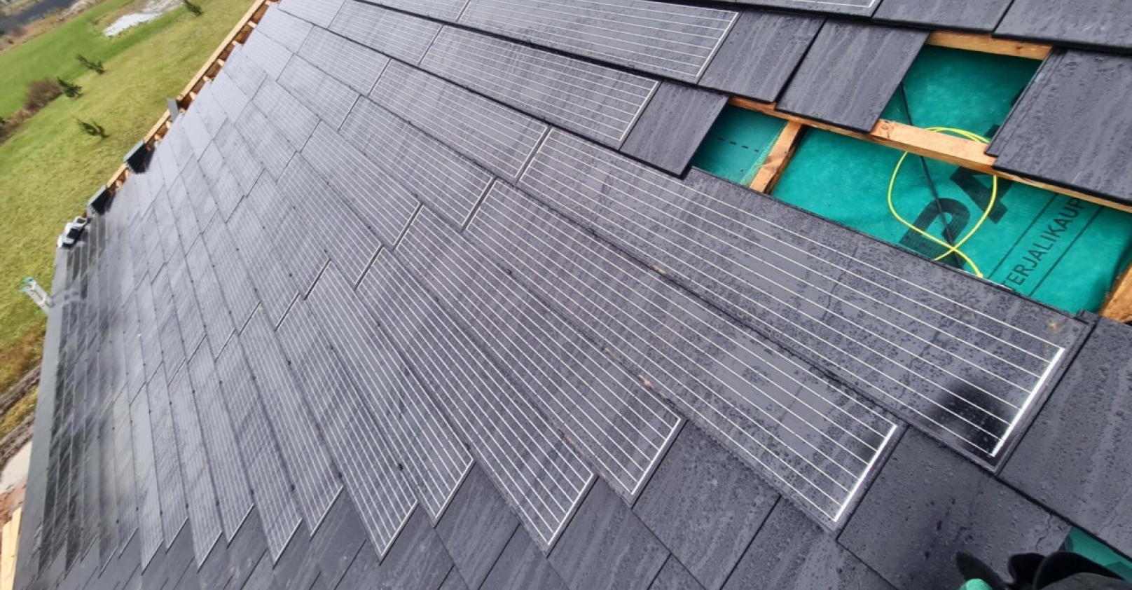 an image of solarstone solar tiled roof with roof tiles