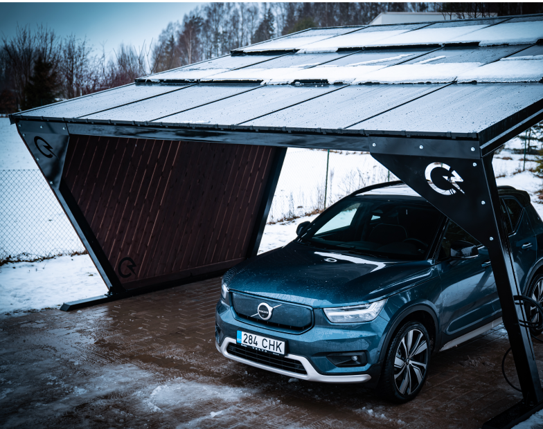 an image of solarstone solar carport with an electric volvo in snowy weather