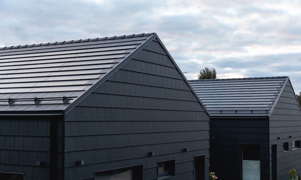 two modern houses with solar roofs