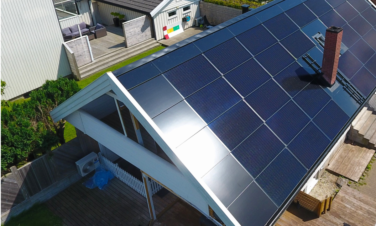 solarstone solar full roof solar panels reflecting sunlight