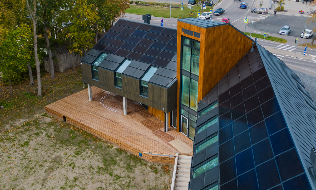 solarstone solar full roof solar panels on a modern business building
