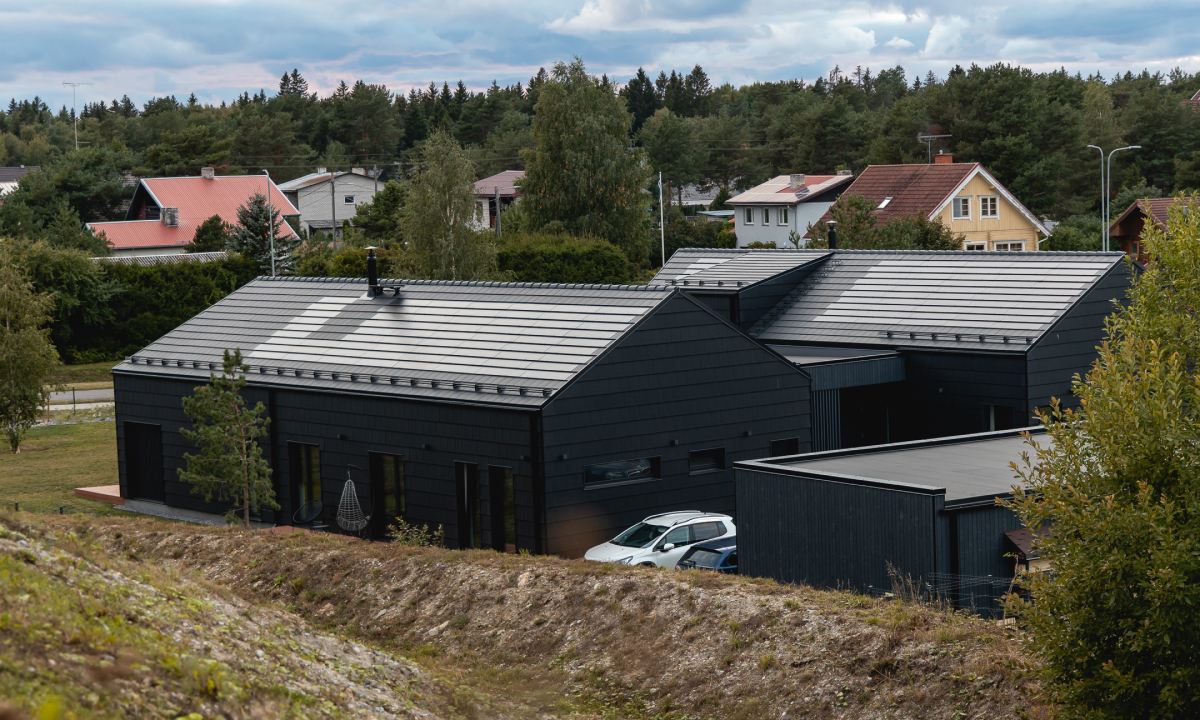 solarstone solar tiled roof on two houses with black roof tiles