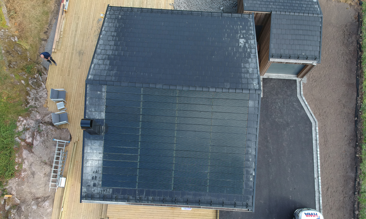 solarstone solar tiled roof on a house combined with black roof tiles