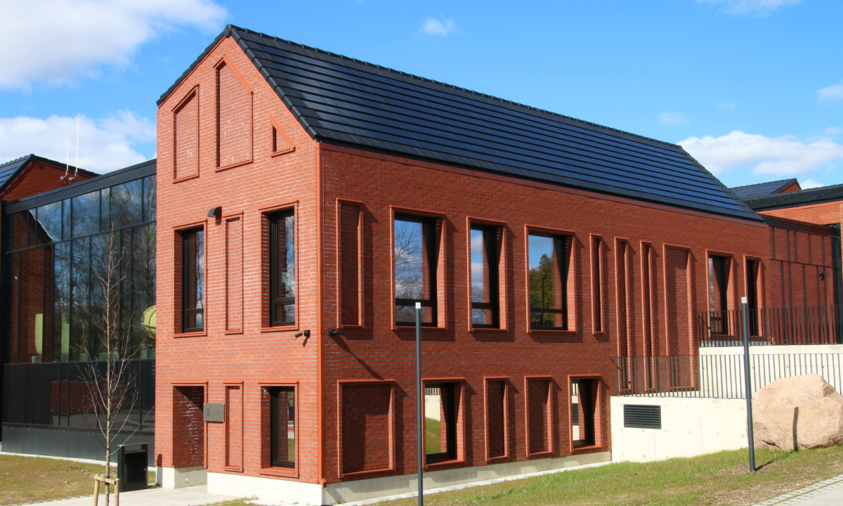 solarstone solar tiled roof on red brick building