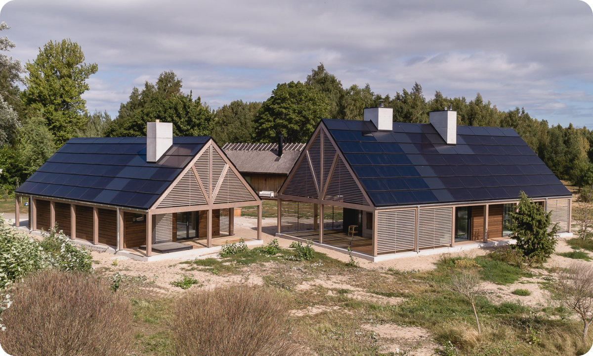 two houses with solar panel roofs
