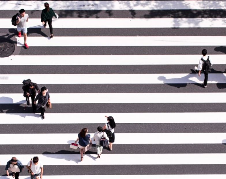 people crossing a crosswalk